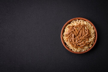 Delicious Asian cuisine dish with rice noodles, peppers, mushrooms and spices