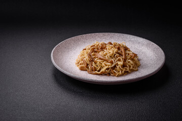 Delicious Asian cuisine dish with rice noodles, peppers, mushrooms and spices