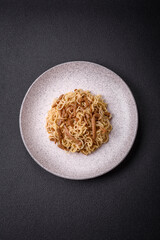 Delicious Asian cuisine dish with rice noodles, peppers, mushrooms and spices