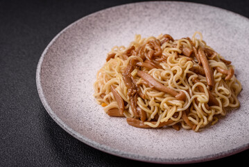 Delicious Asian cuisine dish with rice noodles, peppers, mushrooms and spices