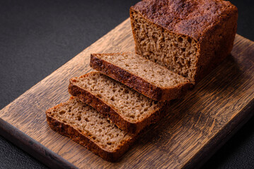 Fototapeta na wymiar Delicious fresh crispy brown bread with seeds and grains