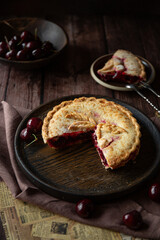 Cherry pie on dark brown background 