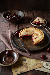 Cherry pie on dark brown background 