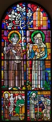 Poster Im Rahmen BERN, SWITZERLAND - JUNY 27, 2022: The St. Fridolin and St. Ulrich on the stained glass in the church Dreifaltigkeitskirche by A. Schweri (1938). © Renáta Sedmáková