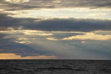 Fototapeta premium Sunset beams into sea. 