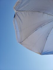 Summer blue sky on the beach with umbrella