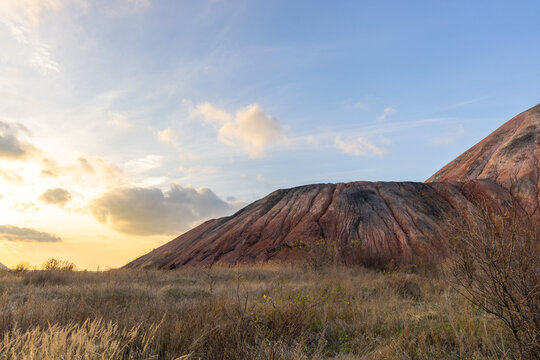 Coal slagheap and beautiful sunset in eastern Ukraine