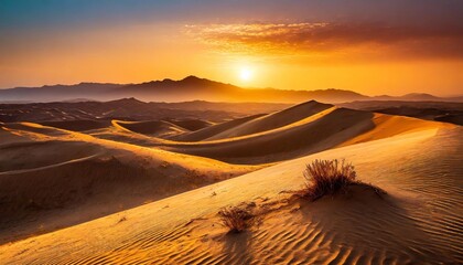Fototapeta na wymiar The sun sets in the desert over the dunes.