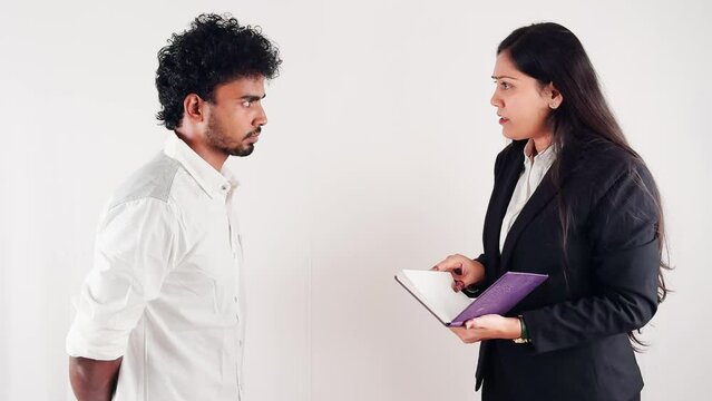 business women scolding to a employ holding notebook facing man with serious expression isolated on white background