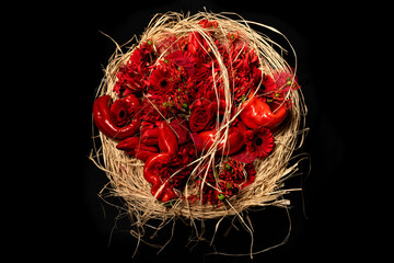 red roses and pumpkins in round wicker flower arrangement