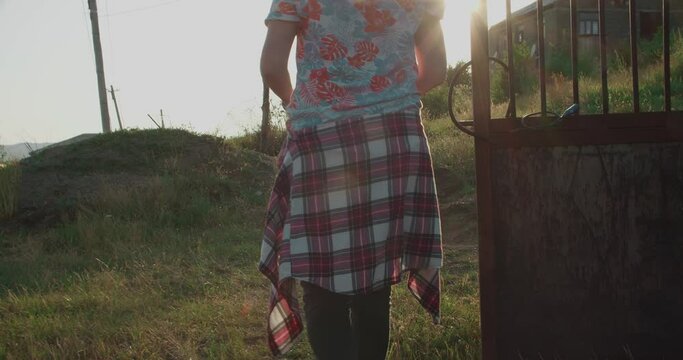 Girl walking on a village path