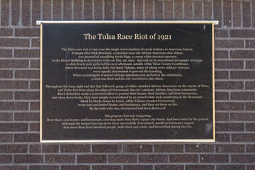 History of the Tulsa Race Riot of 1921 on a wall at the John Hope Franklin Reconciliation Park