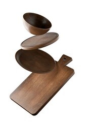 Wooden cutting or chopping boards, wooden plate and bowl floating isolated on white background