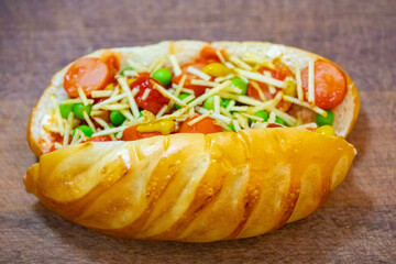 The most traditional Brazilian hot dog, prepared with sausages cut into slices, straw potatoes, ketchup, mustard, peas and mayonnaise
