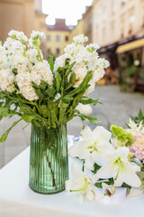 Floral decor for events. Vase of White Hydrangeas with Lilies on Display. Background