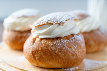 Semla or vastlakukkel is a traditional sweet roll with whipped cream made in Scandinavic, Baltic countries