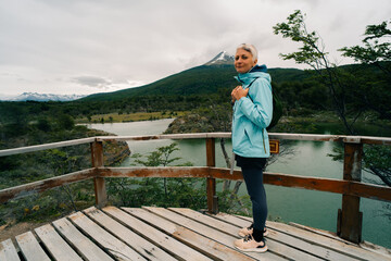 tourist in Bahia Lapataia amidst mountains at Tierra del Fuego