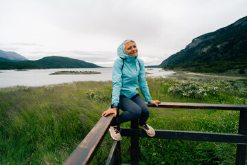 Fototapeta na wymiar tourist in Bahia Lapataia amidst mountains at Tierra del Fuego