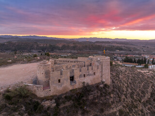 Aerial colorful sky sunset panoramic view of Flix new castle above the Ebro river in Spain with...