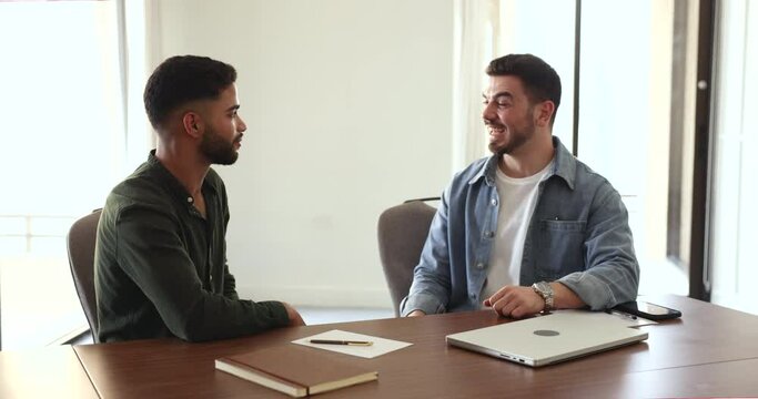 Arabian businessmen handshake after negotiations on meeting, make deal in boardroom, conclude partnership agreement, satisfied with cooperation. Middle eastern recruiter hires applicant at interview