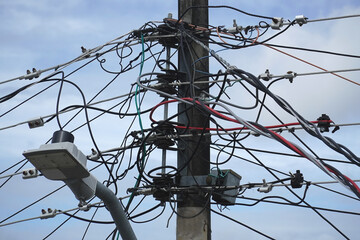 Tangle of cables on electricity pylons. Cable clutter on an street power pole in Manaus, where...