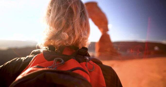 Female Delicate Arch sunset Arches National Park Moab Utah 