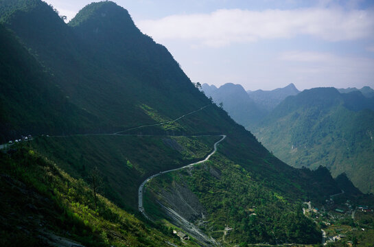 Zigzag road between mountains and forest in Ha Giang, Vietnam