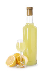 Tasty limoncello liqueur and lemons isolated on white