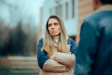Sad Woman Fighting with her Husband Outdoors in the Park. Woman suffering after a break-up quarrel with her boyfriend
 - obrazy, fototapety, plakaty