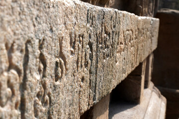 Inscriptions of Tamil language carved on the stone walls at Kailasanathar temple in Kanchipuram. Indian rock art relief carvings of Historical ancient vintage Tamil text in Temples. 
