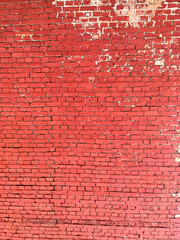 Colorful brick wall on the house. Texture of red stone blocks, close up. Background.