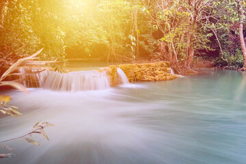 Beautiful golden sunlight  and Waterfall forest view in Kanchanaburi Thailand. 