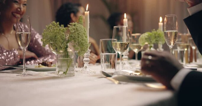 Champagne, glasses and dining with celebration, people and closeup with party, goals and success. Bubbles, drink and group with achievement at event, conversation and birthday with wine and talk