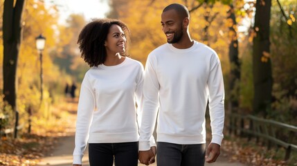 a couple wearing smiling a crew neck 18000 white long sleeve mockup, walking down path in a park 