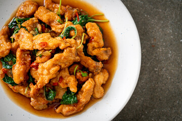 stir-fried fried fish with basil and chili in thai style