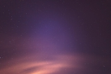Fototapeta na wymiar Purple Starry Night Sky with Hazey Clouds