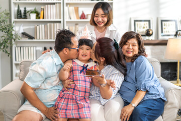 Portrait of happy love asian big family father and mother with asian baby and little girl happy birthday, party, celebration, cake, surprise, grandmother smiling together.Family party