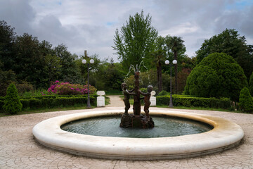 View of the fountain in the arboretum park 