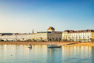 Llandudno, North Wales - Pleasure cruise boats and hotels along the promenade at Llandudno on a...