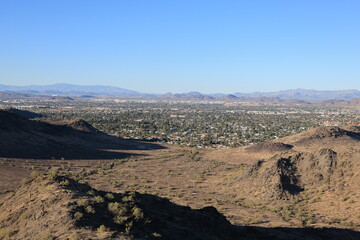 Moon Valley in North Phoenix as seen from across hills and buttes from North Mountain Park hiking trail, Arizona