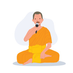 Sitting Thai Monk in Traditional Robes with Microphone is speaking , giving knowledge about buddhist