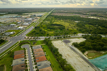 Fototapeta na wymiar Aerial view of construction site with new tightly packed homes in Florida closed living clubs. Family houses as example of real estate development in american suburbs