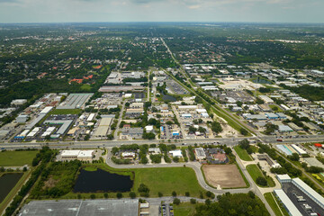 Aerial view of industrial park with goods warehouses and logistics centers in city zone from above