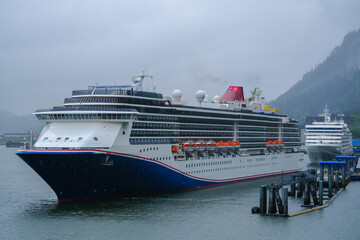 Modern family cruiseship cruise ship liner Spirit docked in Juneau, Alaska with panoramic nature...