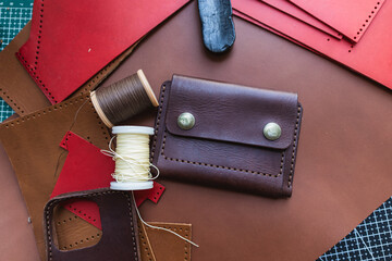 Genuine vegetable tanned leather working leather wallet on leather background