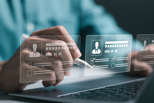 Businessman use laptop to checking resume for employee recruitment. Screening employee information and job applicants. HR, Human resource management concept.
