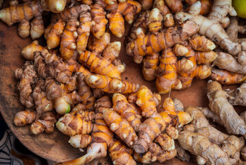 Turmeric roots are piled for sale at a farmers market on Kauai