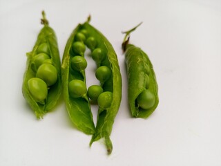 green peas on a wooden table