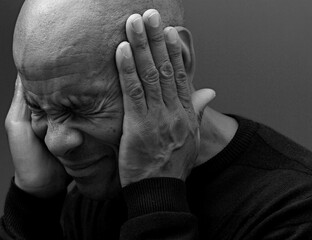 Fototapeta premium deafness suffering from hearing loss on grey black background with people stock image stock photo 