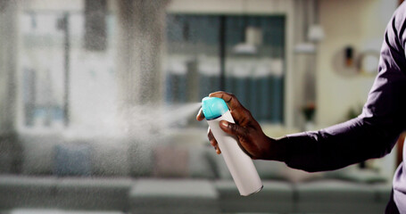 African Man Using Air Spray